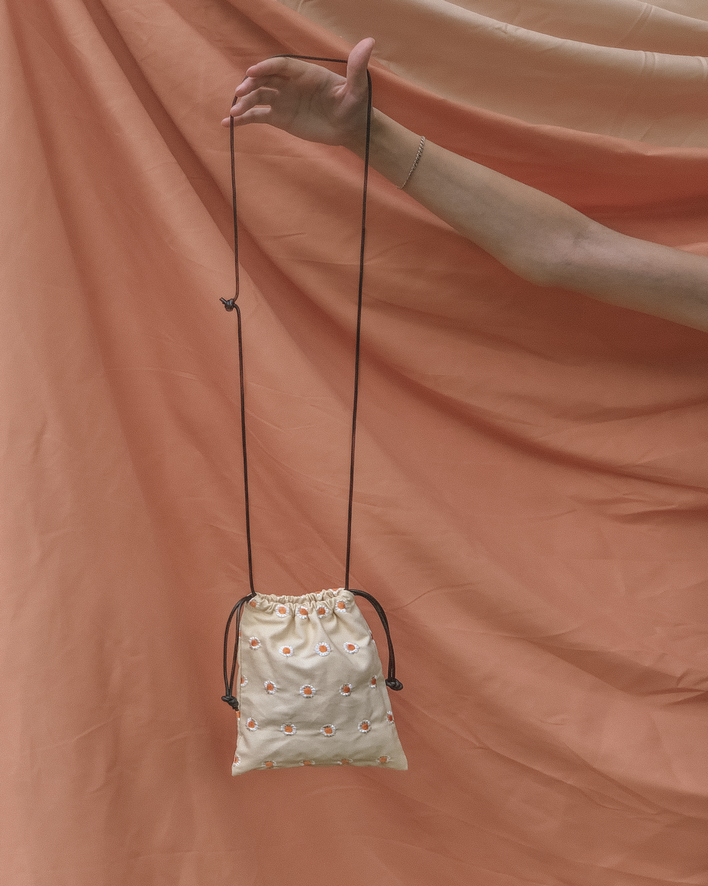 Daisy Drawstring Sling Bag by Veronique